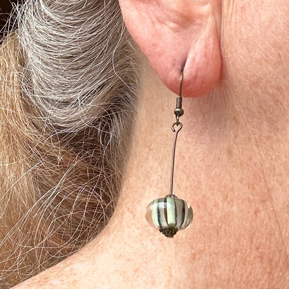 Dangle earrings new, hand crafted with glass bead and bronze metal.